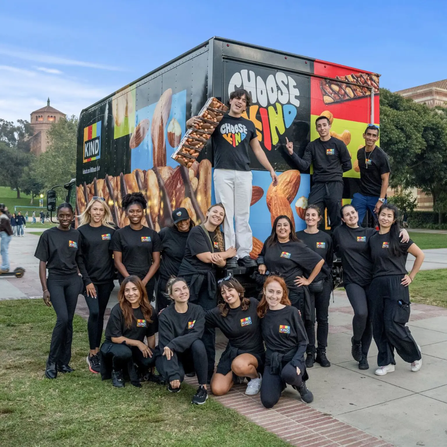 Image of a nationwide experiential marketing staffing team posing in front of a branded sampling truck