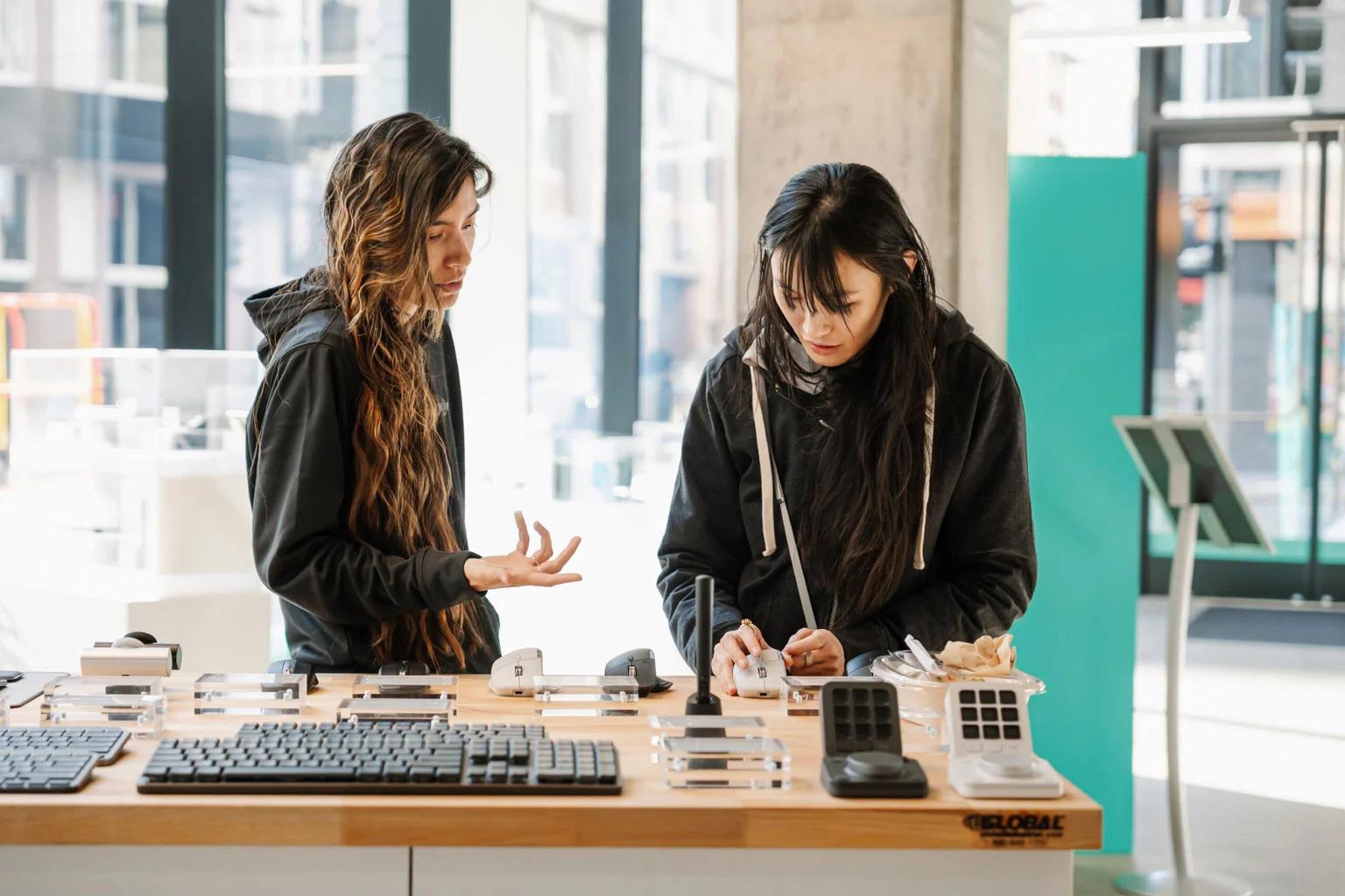 2 woman working on a table