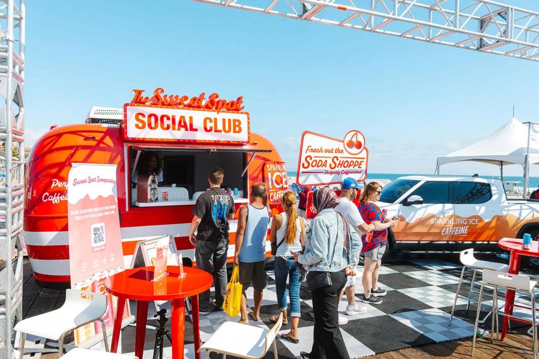 Image of guests lined up at the Sweet Spot Social Club Sparkling Ice branded truck