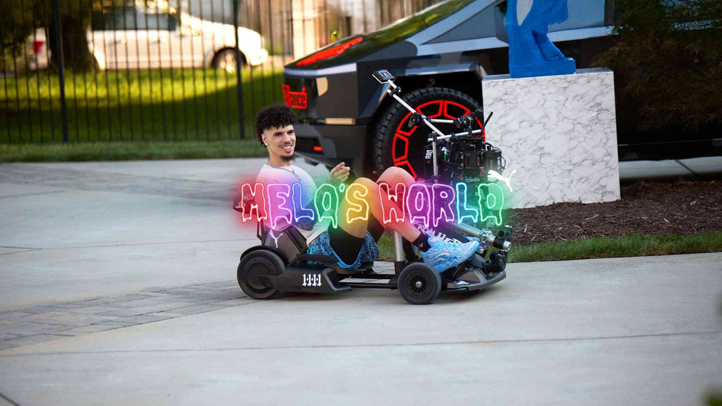 LaMelo Ball seated in a go-kart in a driveway