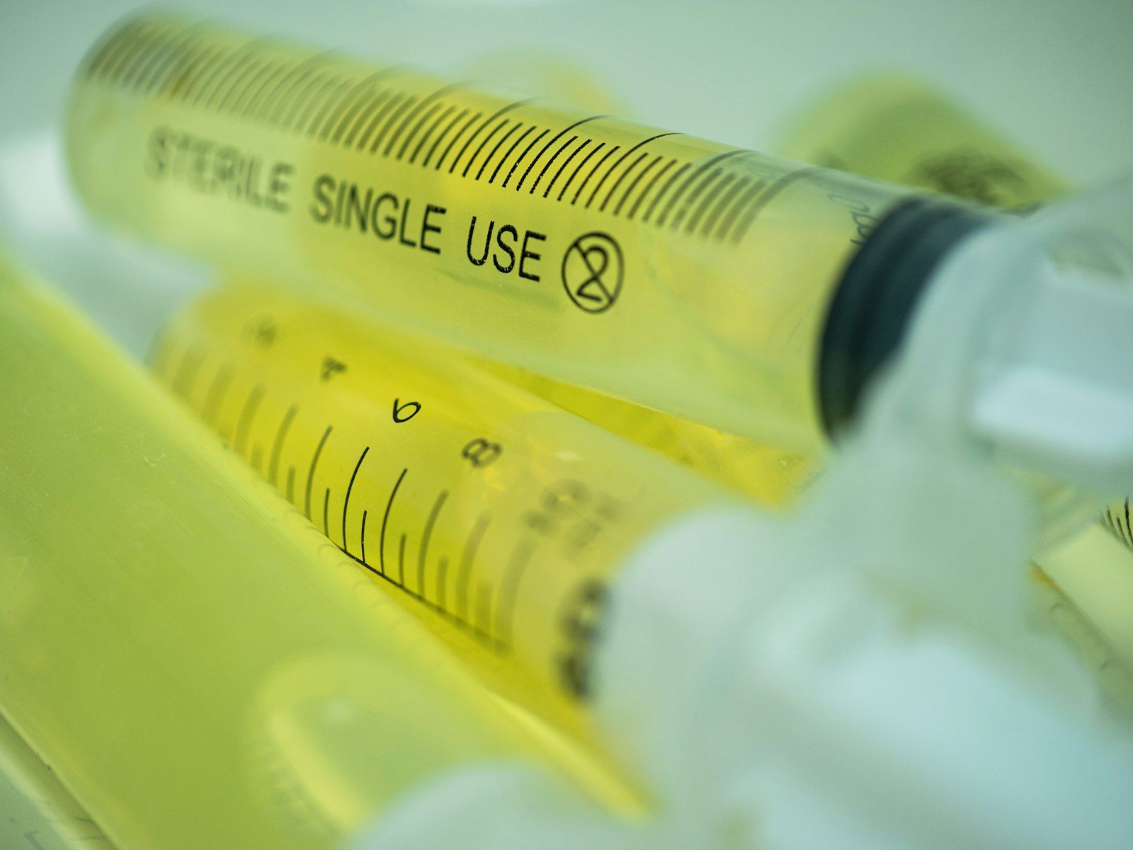 Sterile syringes filled with yellow liquid