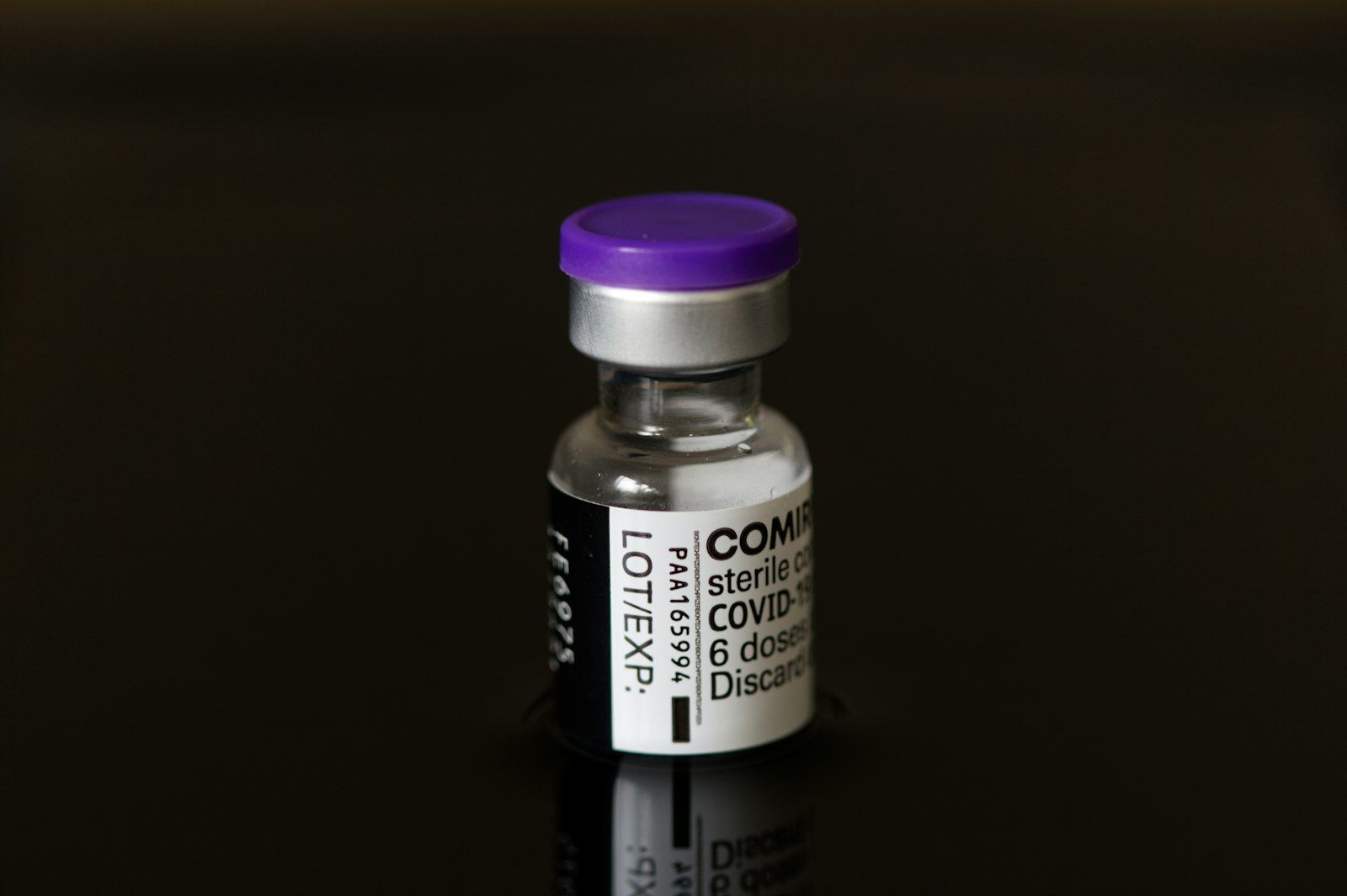 purple and white plastic bottle