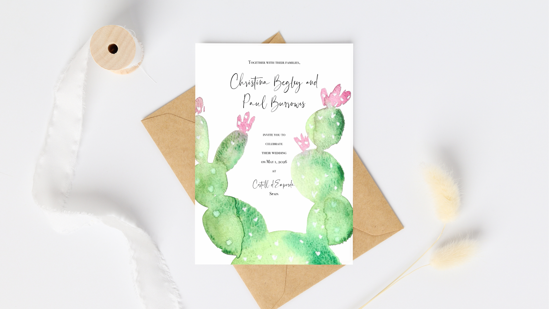 flat lay photo of wedding invitation featuring a watercolour cactus