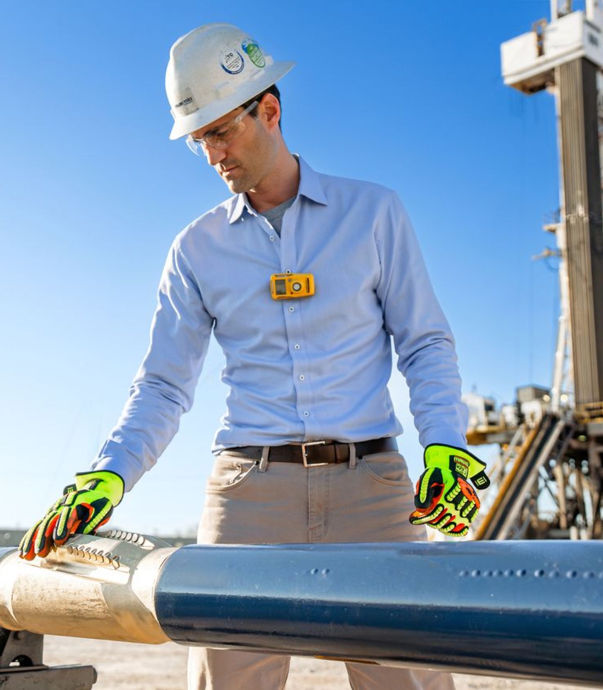 A technician inspecting a drilling tool.