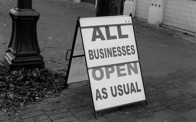 Local high street businesses with open signs, representing small business promotion