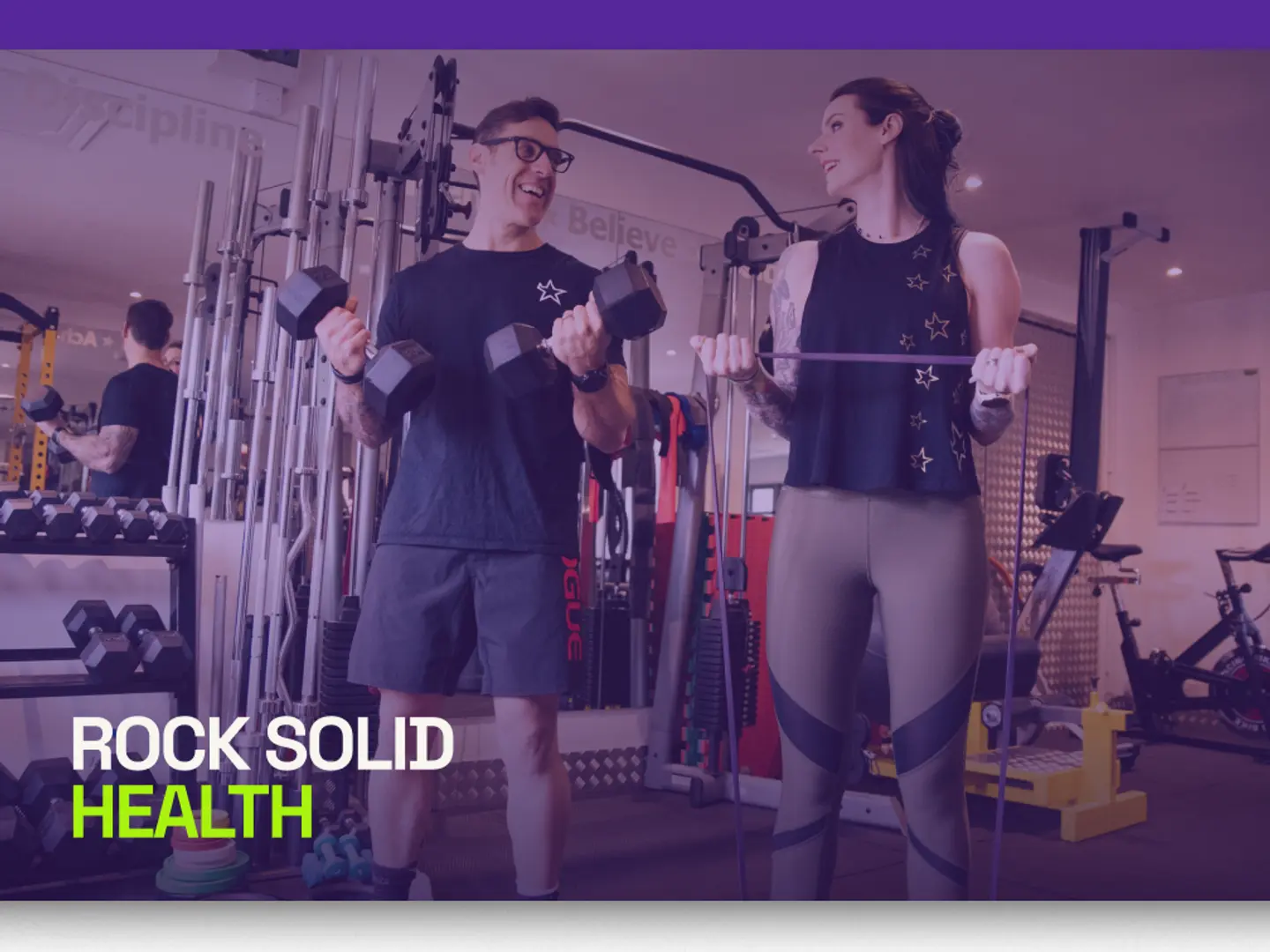Two people training with dumbbells in the gym, under the Rock Solid Health wordmark