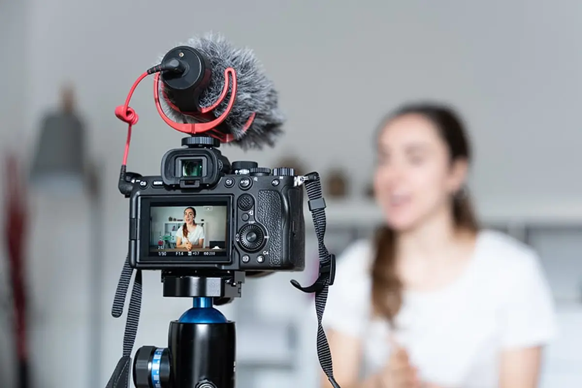 a business women recording a video with a clear audio for her business