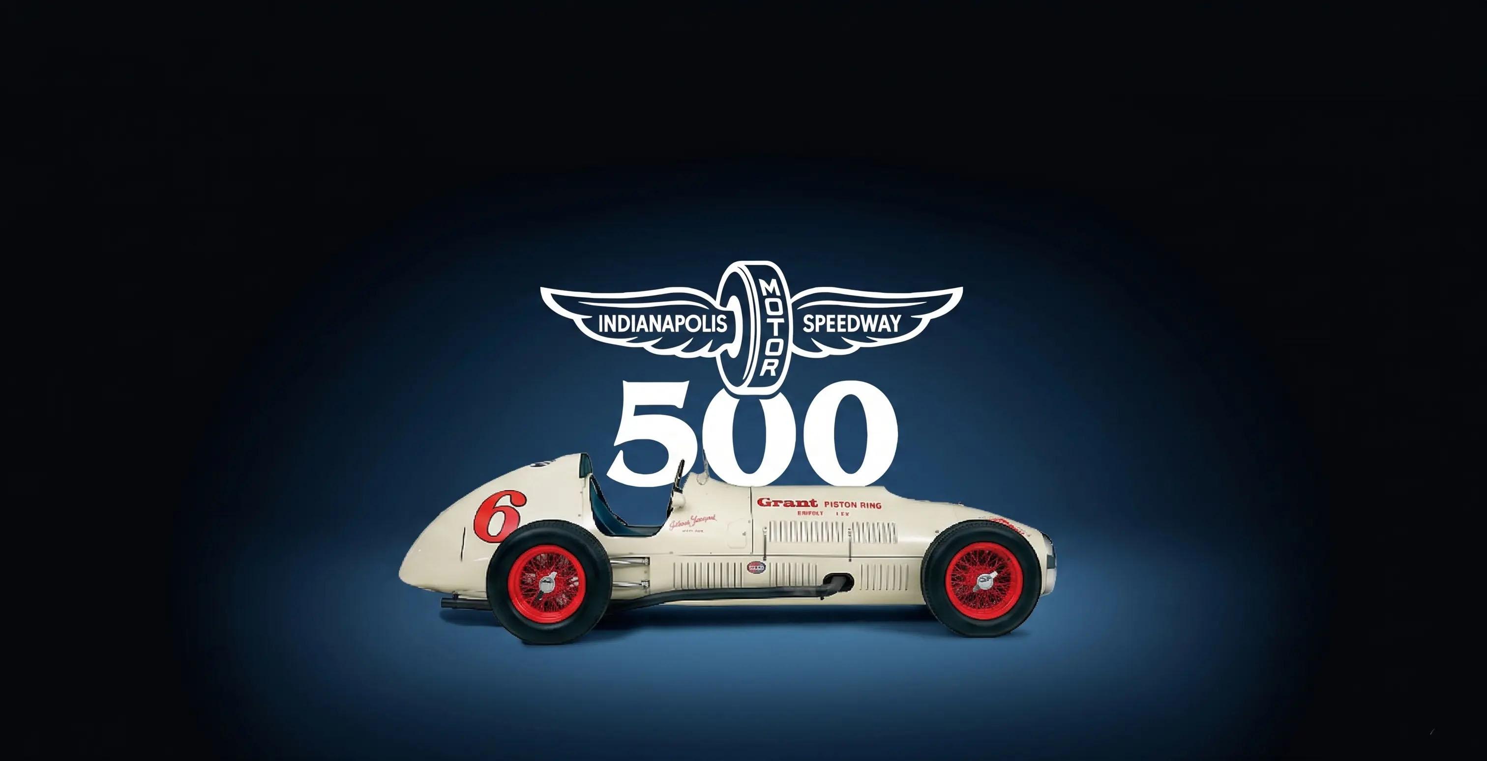 Side view of Indy 500 with white title 500 Indianapolis Motor Speedway in dark blue studio