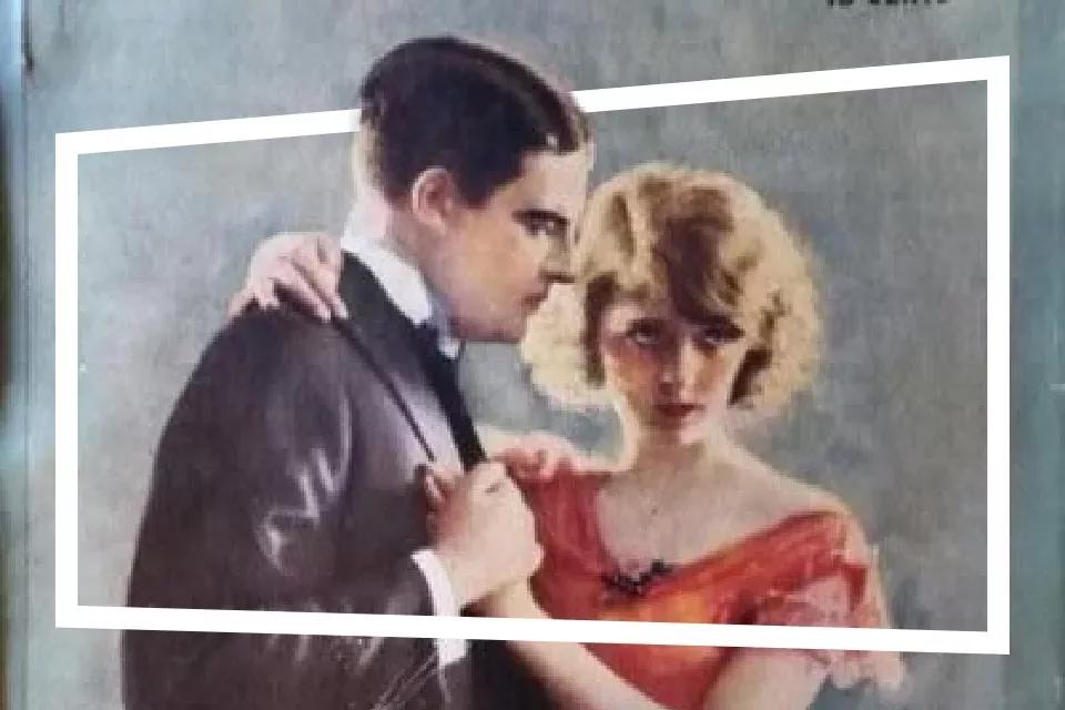 Man en vrouw die elkaar vasthouden voor een grijze muur