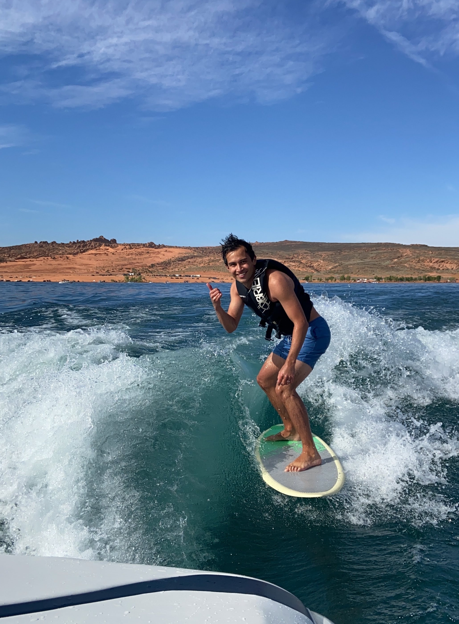 Attractive man surfing at sand hollow