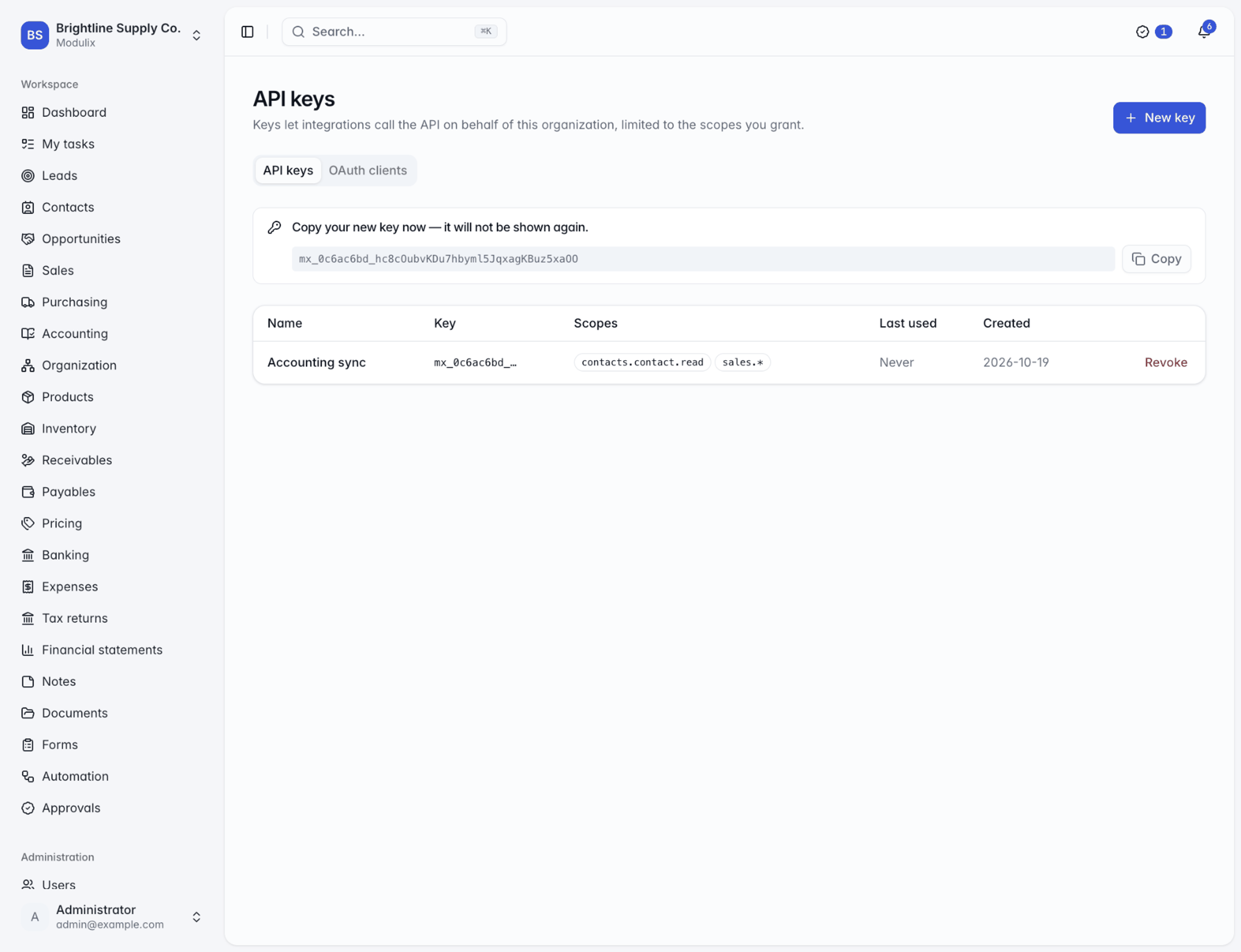 The API keys page with a newly created key shown once, and the list of keys with their scopes