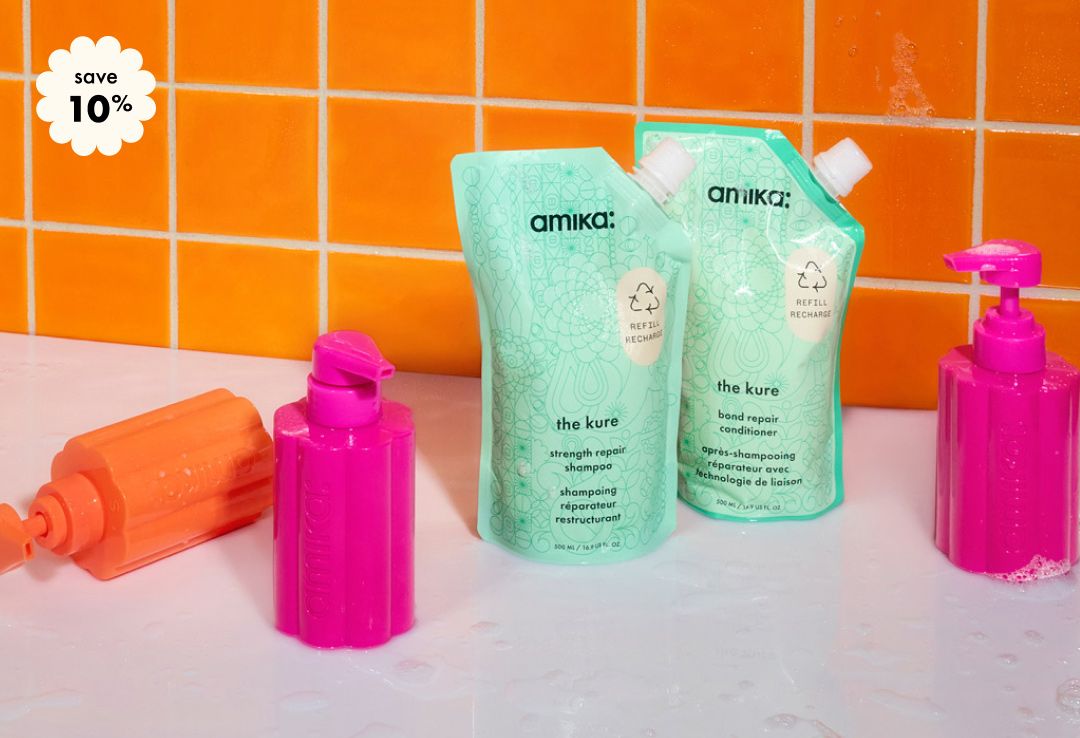 save 10% on your custom amika refill bundle. 2 refill pouches and one pink and one orange refillable bottles sit against an orange tiled background