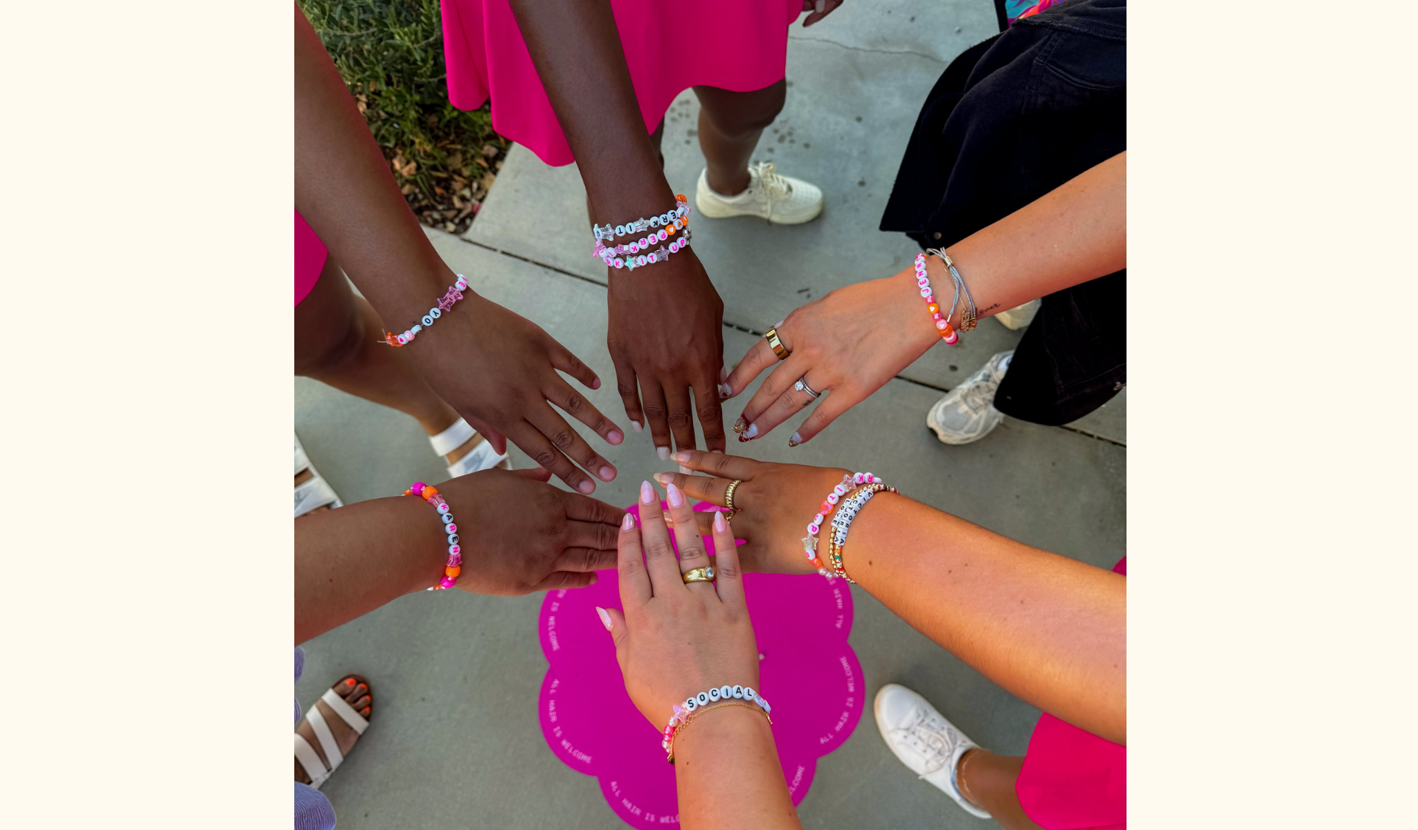 six different people's hands in a circle celebrating friendship day