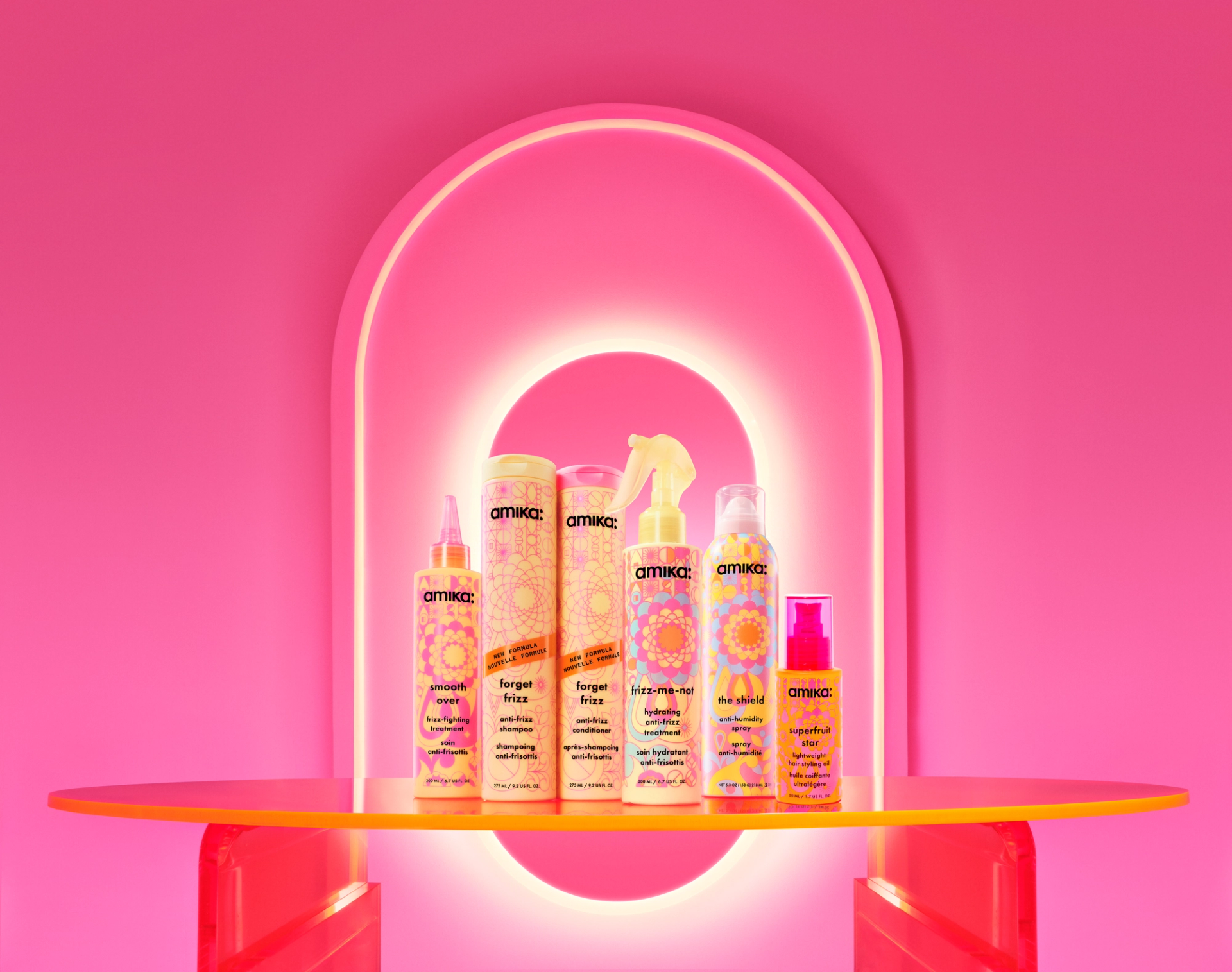 Image of the update anti-frizz collection. from left to right: smooth over frizz-fighting treatment, forget frizz anti-frizz shampoo, forget frizz anti-frizz conditioner, frizz-me-not hydrating anti-frizz treatment, the shield anti-humidity spray, and velveteen dream smoothing balm.