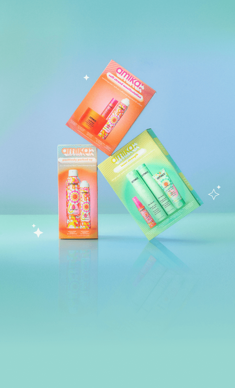 amika gift sets soft strand manifestation, positively perk up, and inner strength are set against a light blue backround