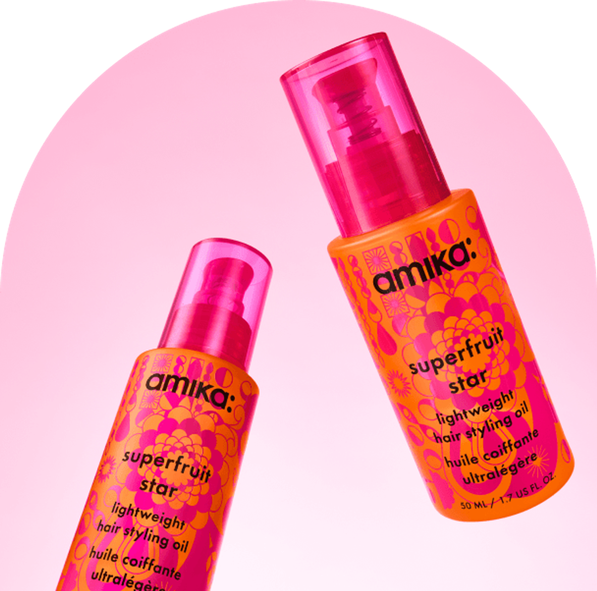 bottles of amika superfruit star float against a pink background