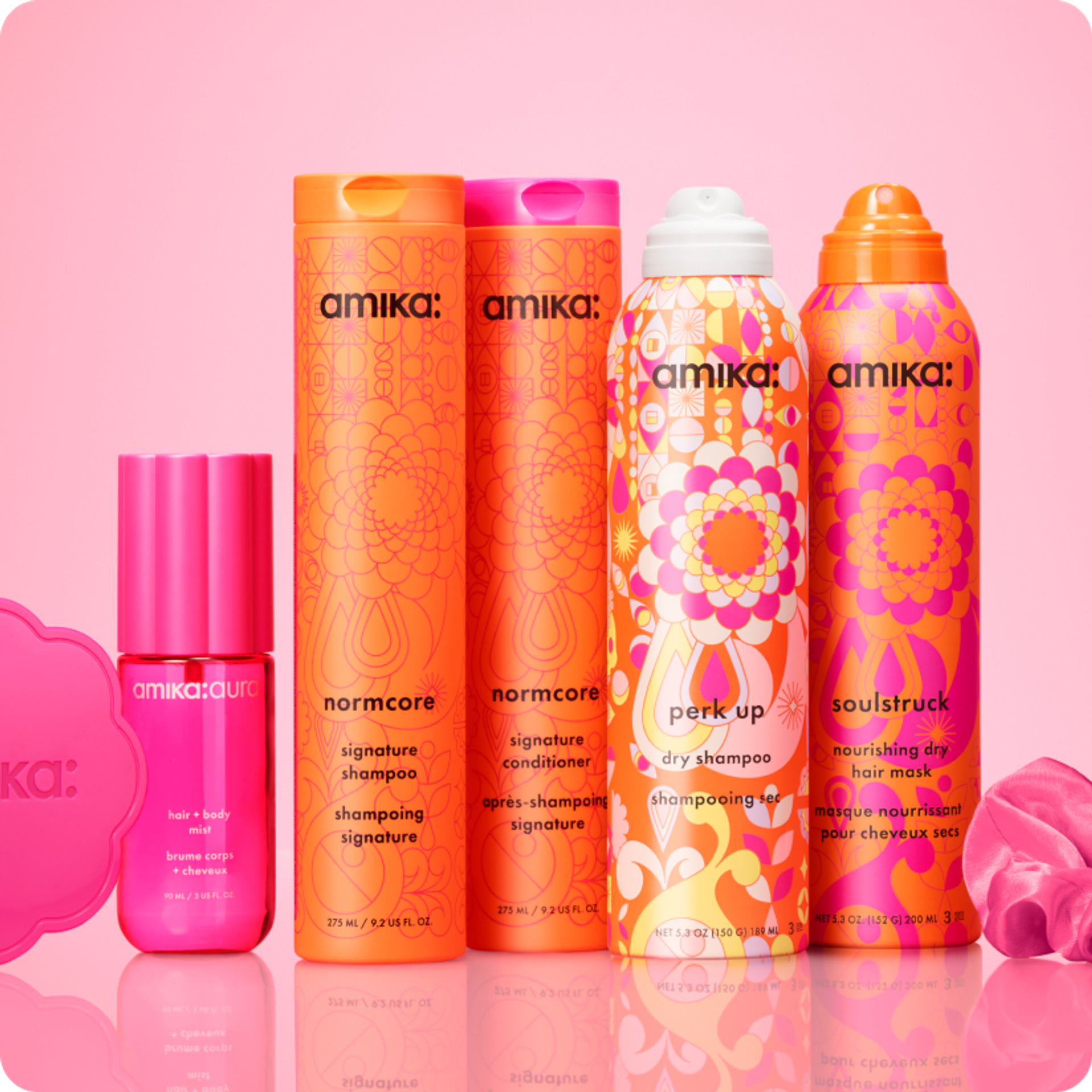 amika products on a pink shelf with pink background