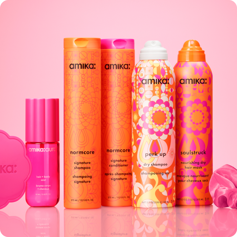 amika products on a pink shelf with pink background