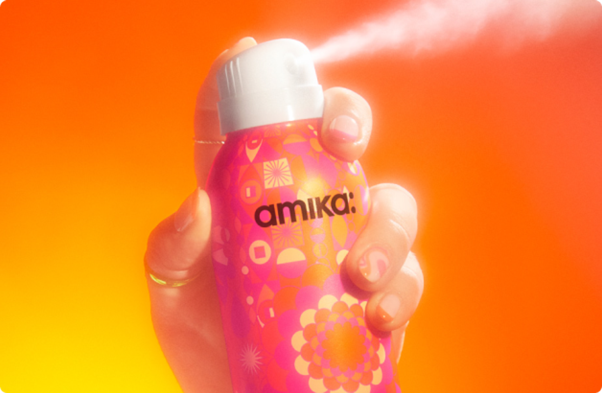 hand spraying perk up dry shampoo