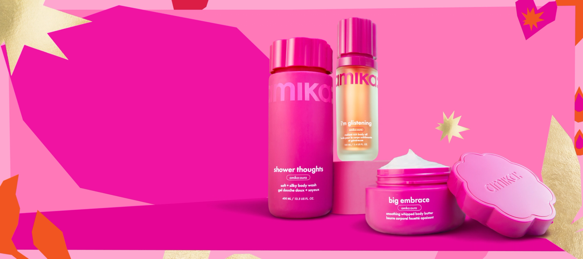 amika body products sit against a dark and light pink background with a pastel patterned border. a gold starburst is in the pink background and a dark pink heart is in the top right corner