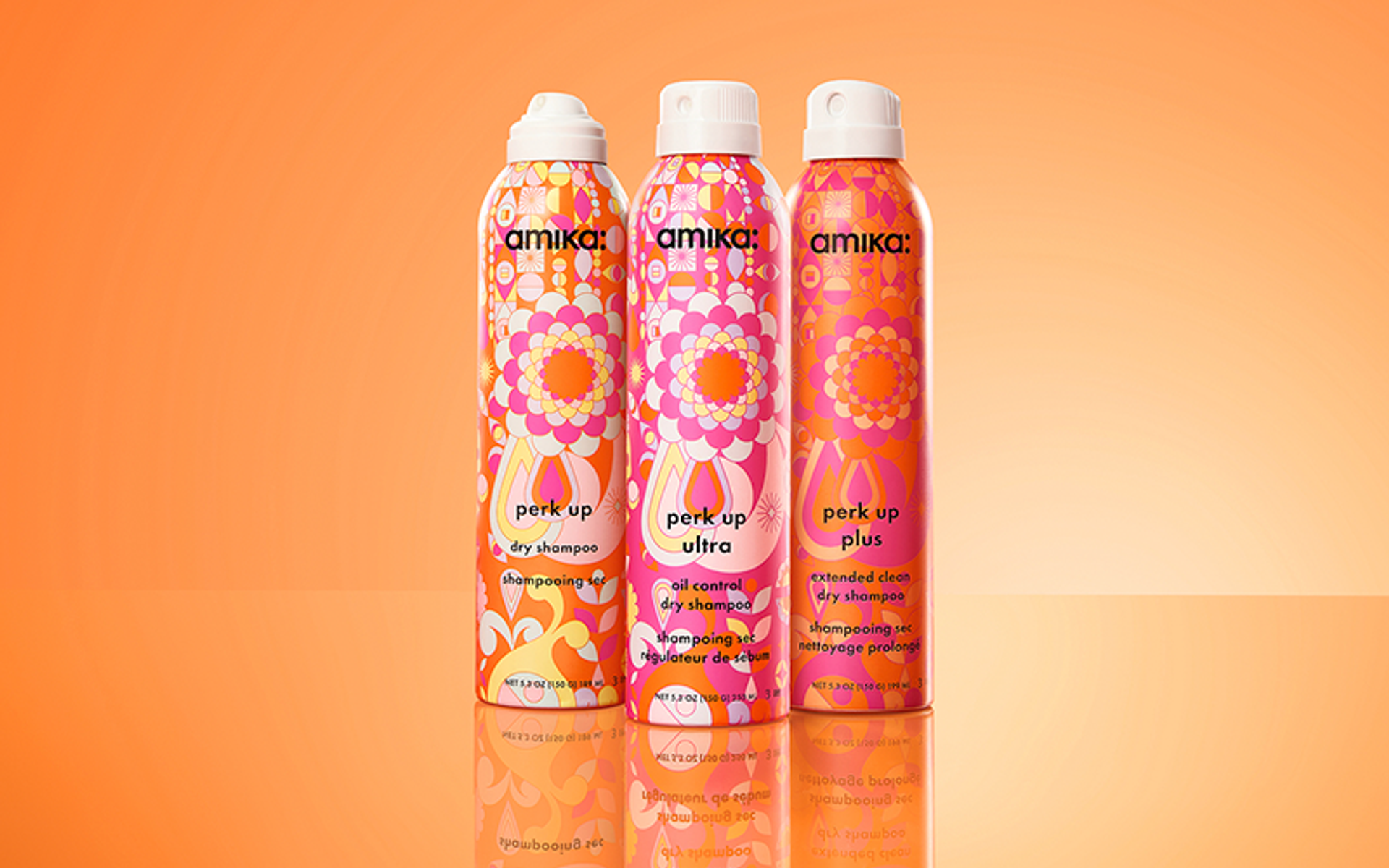 amika perk up dry shampoo collection - image features 3 full size (5.3 oz) bottles of perk up, perk up plus, and perk up ultra dry shampoos.