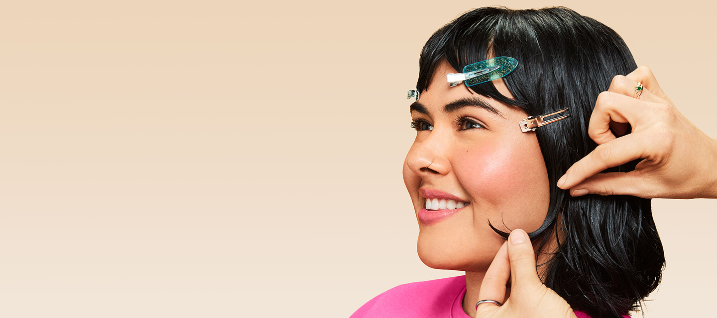 Image for stylist collective, shows a model having hair done