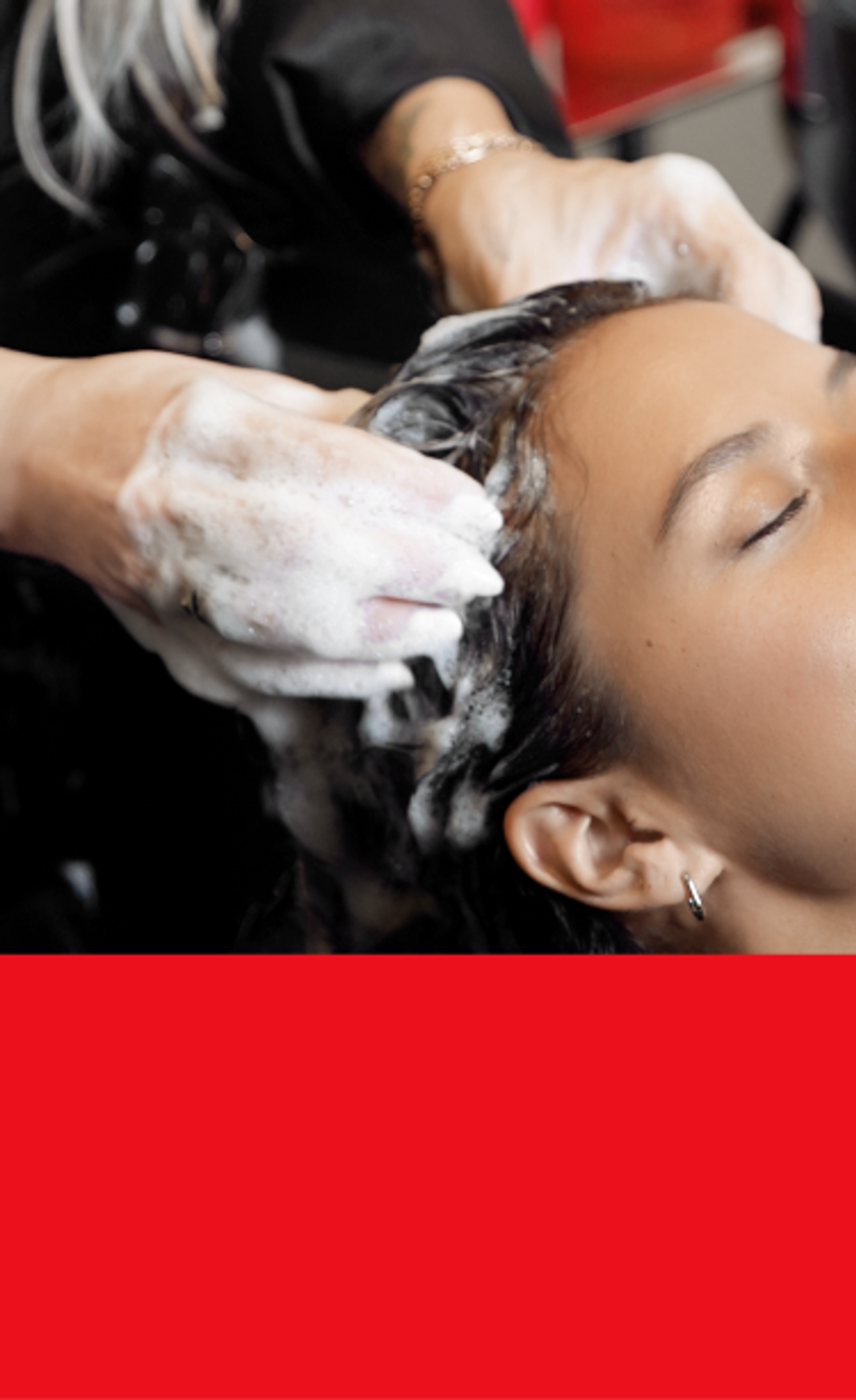 a hairstylist shampooing a client's hair