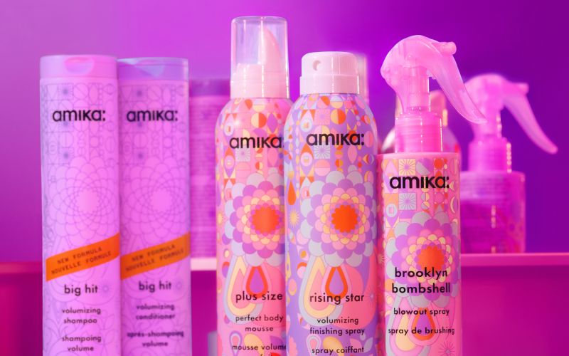 amika volumizing collection showcasing big hit shampoo and conditioner; plus size mousse, rising star finishing spray, and brooklyn bombshell