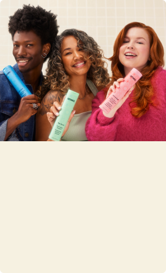 models posing with amika shampoo and conditioners on a white tile background