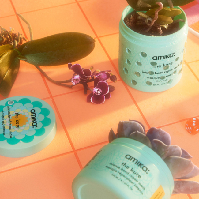 upcycled amika the kure bond repair mask containers with succulent plants inside