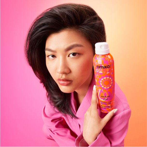 model holding perk up plus extended clean dry shampoo