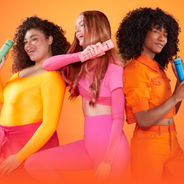 group of models holding different amika shampoo bottles
