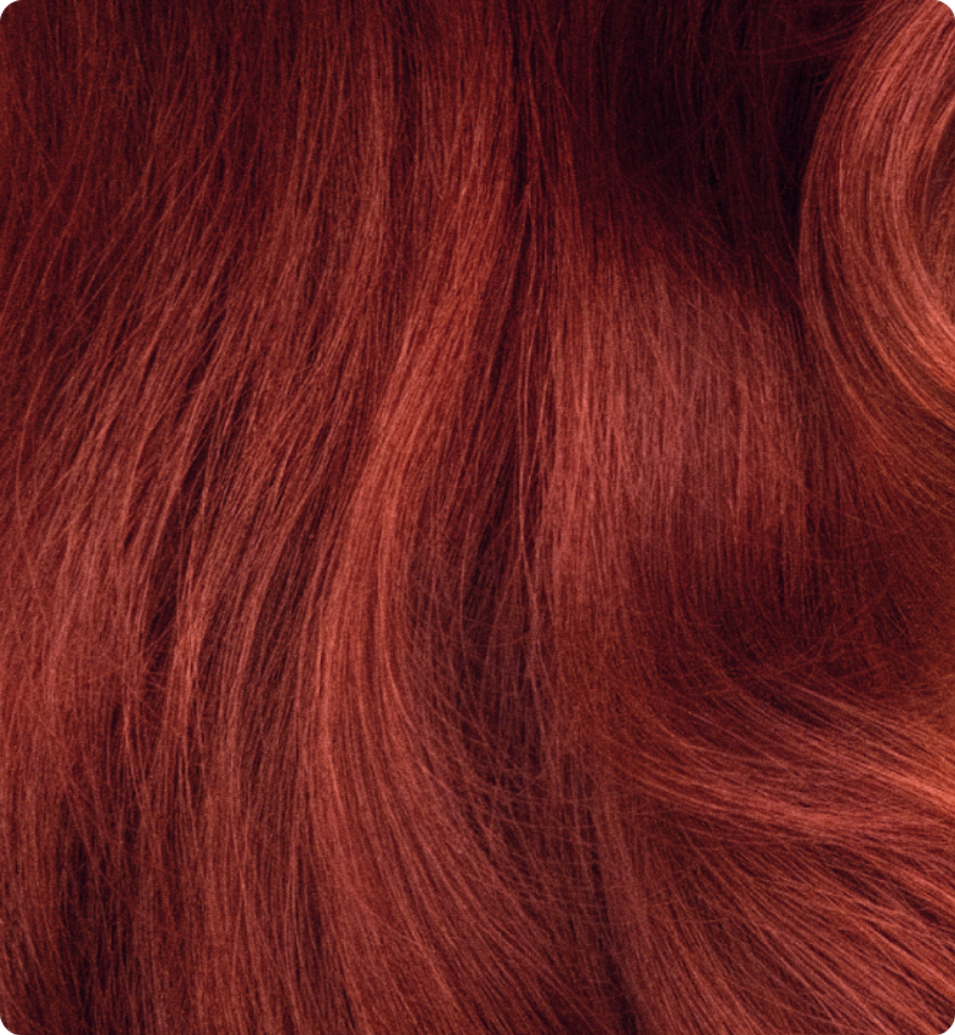 close-up image of vibrant, wavy red hair