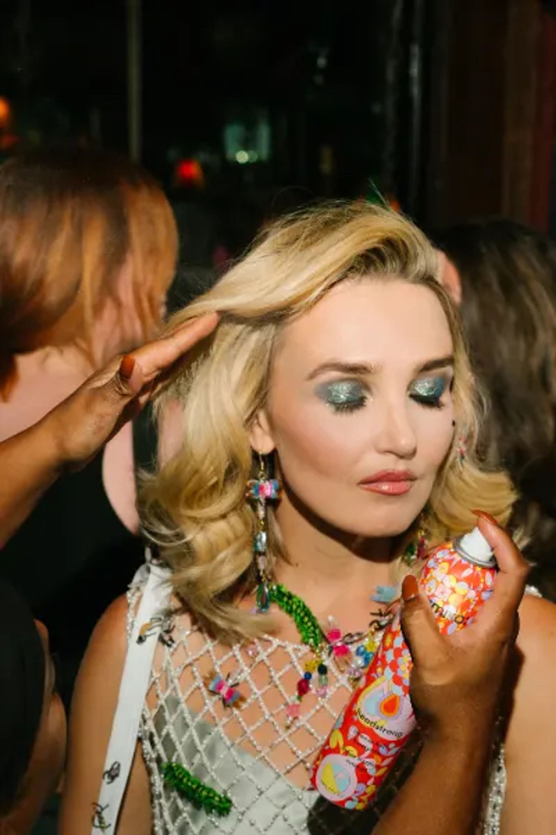 Chloe Fineman's hair being styled