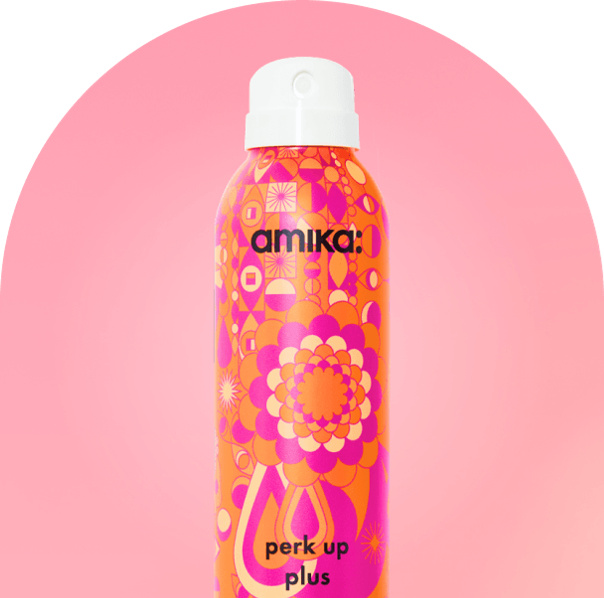 amika perk up plus bottle against a pink background