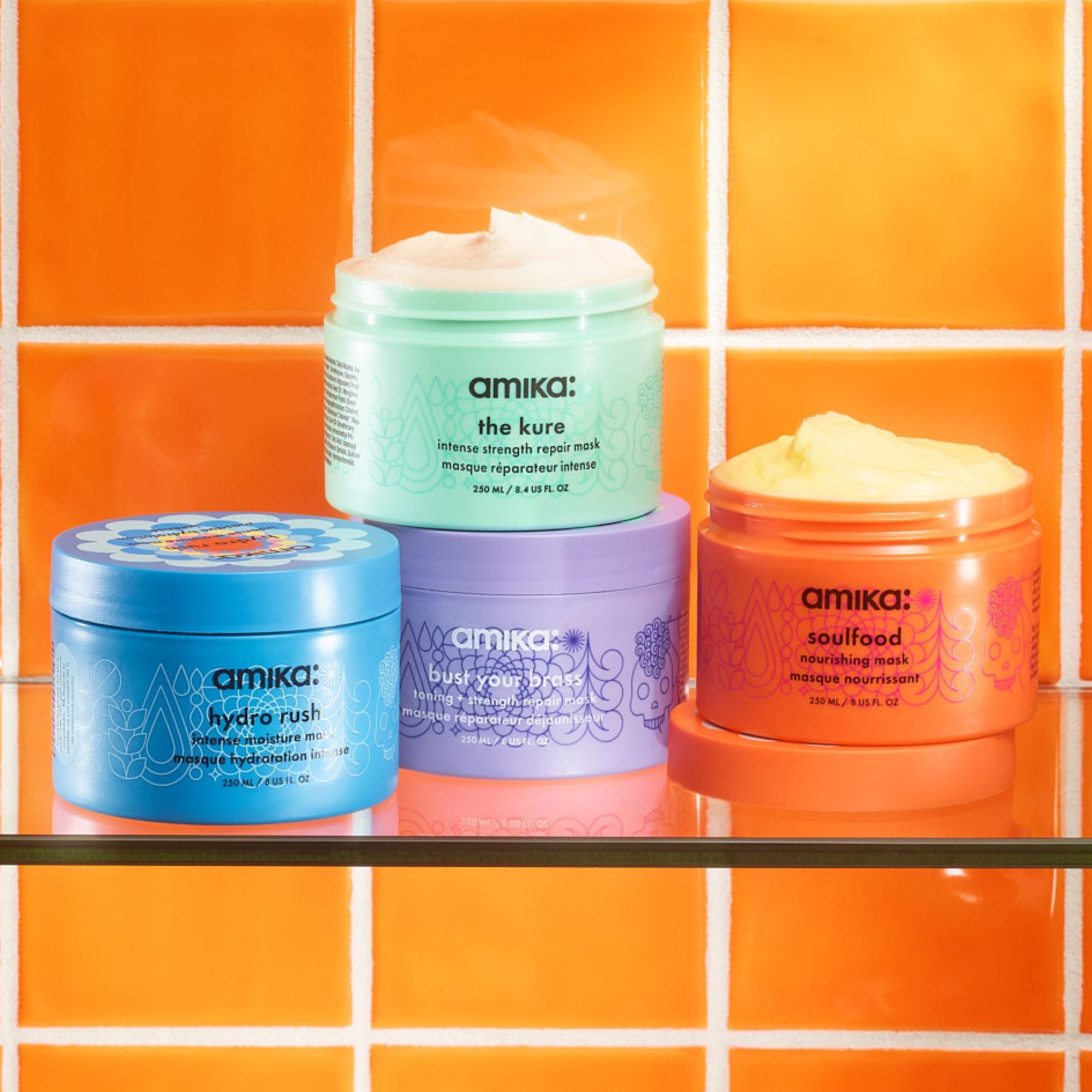 image of amika's hydrating masks. image features the kure intense strength repair mask 8 fl. oz, hydro rush intense moisture mask 8 fl. oz, bust your brass toning + strengthening mask 8 fl. oz, and the soulfood nourishing mask 8 fl. oz.