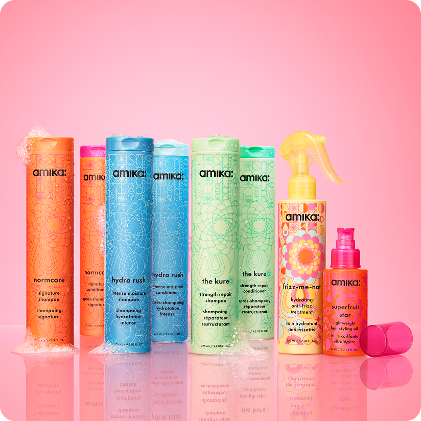 amika products on a pink shelf with pink background