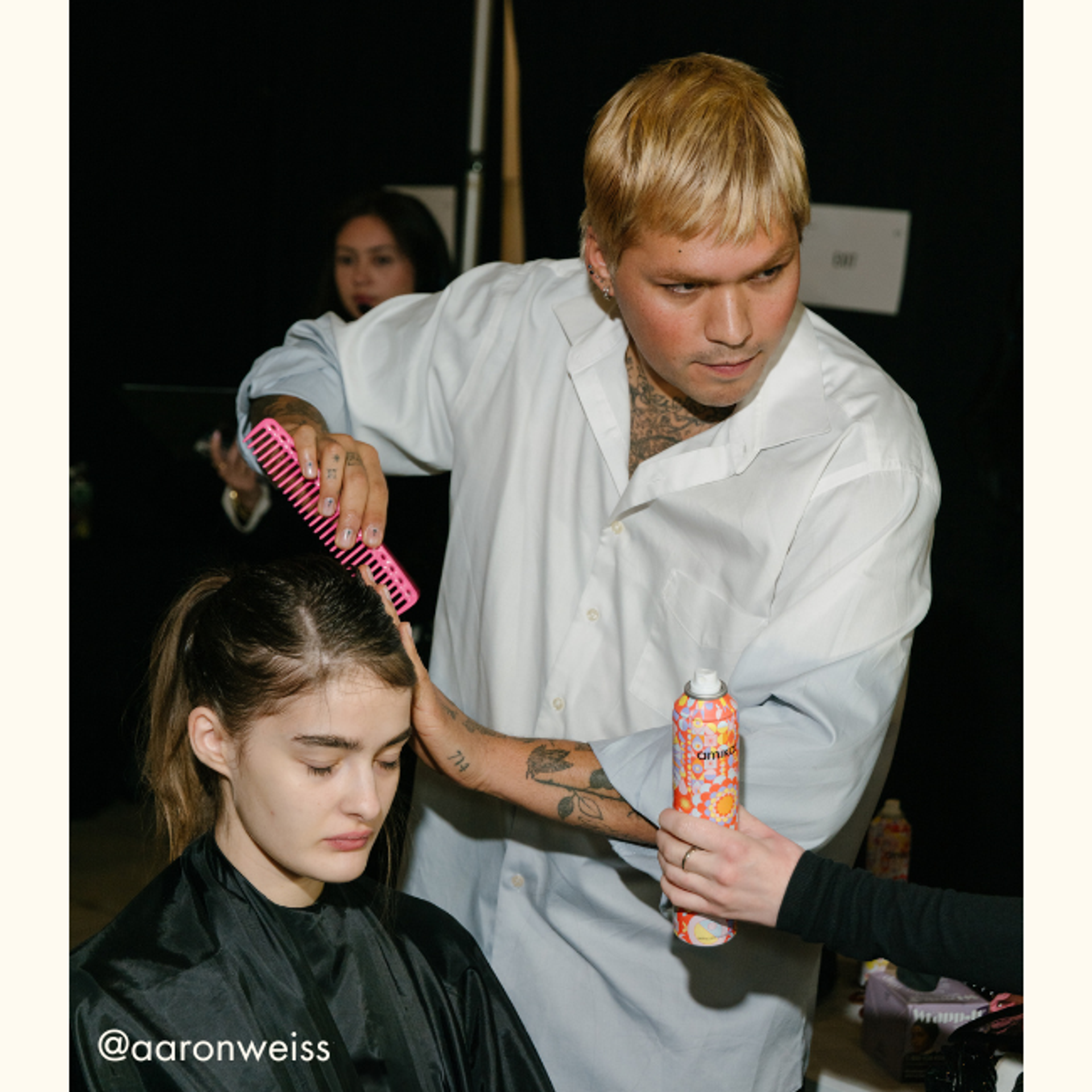 a stylist uses amika products at the sandy liang fashion show 2025
