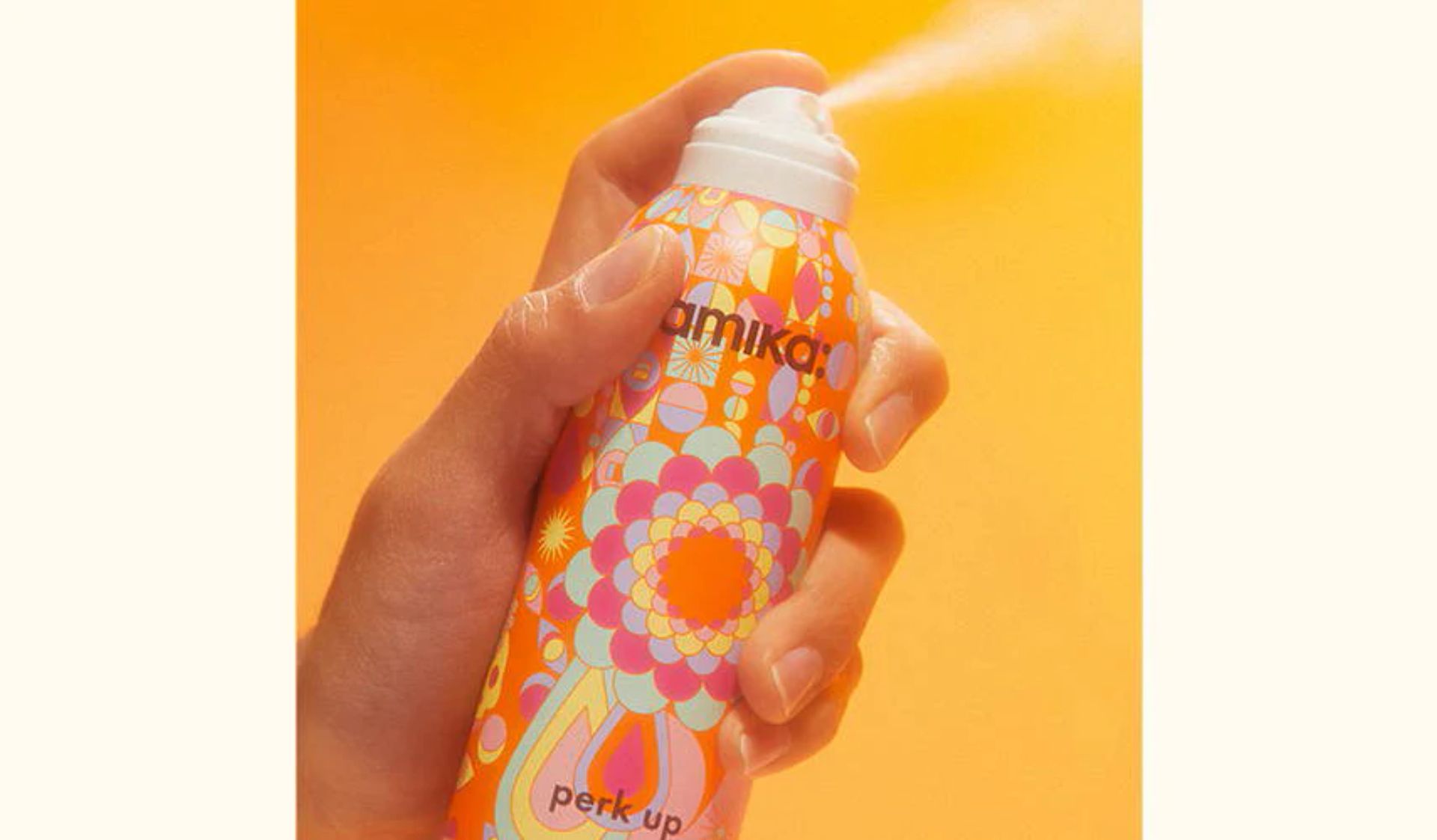 hand spraying perk up dry shampoo