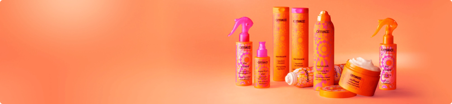 amika products in front of a orange gradient background