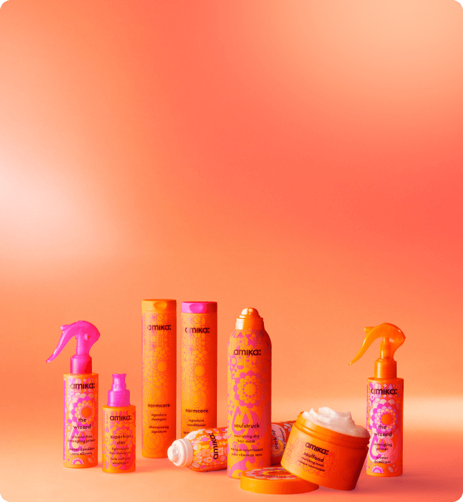amika products in front of a orange gradient background