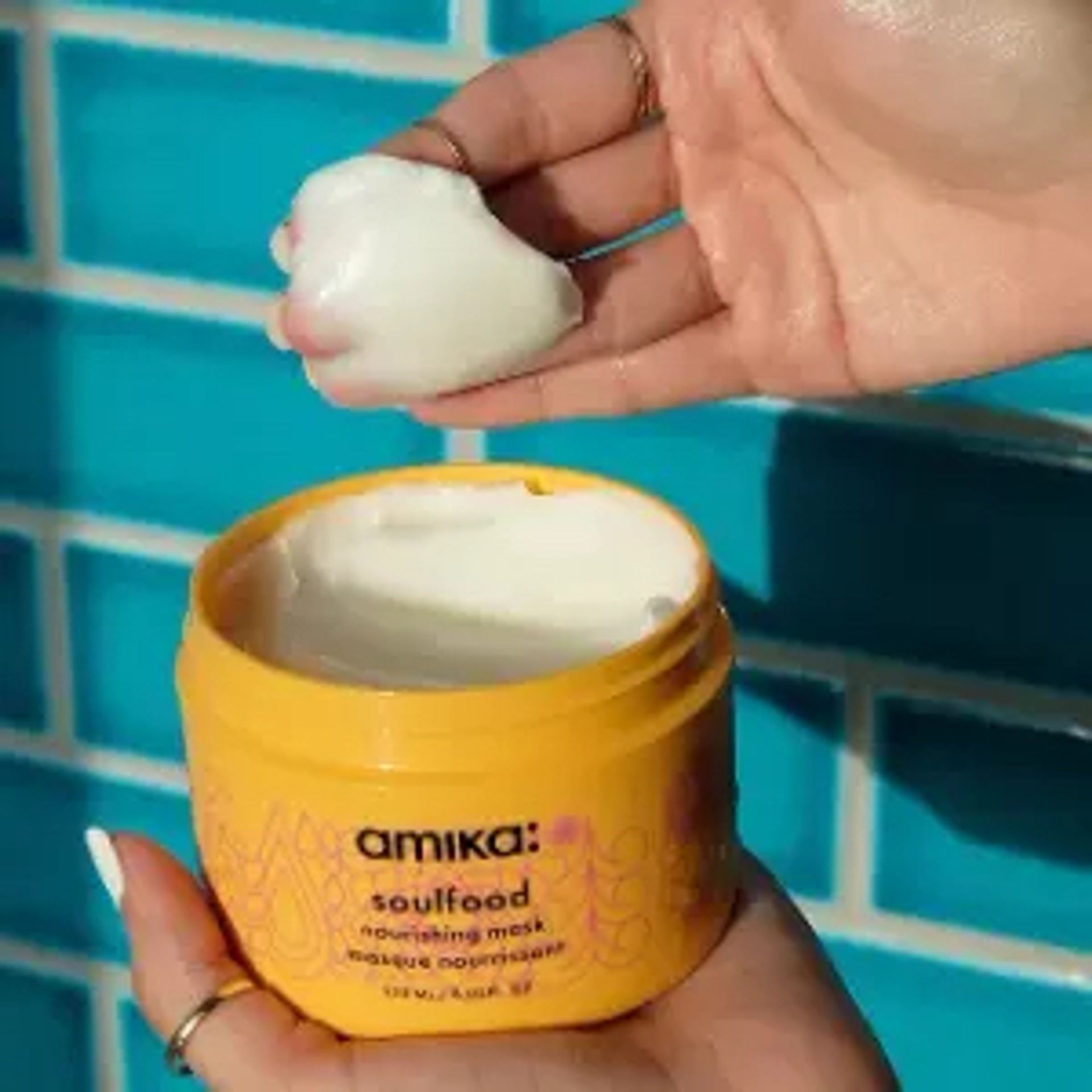 hand scooping soulfood nourishing mask out of jar