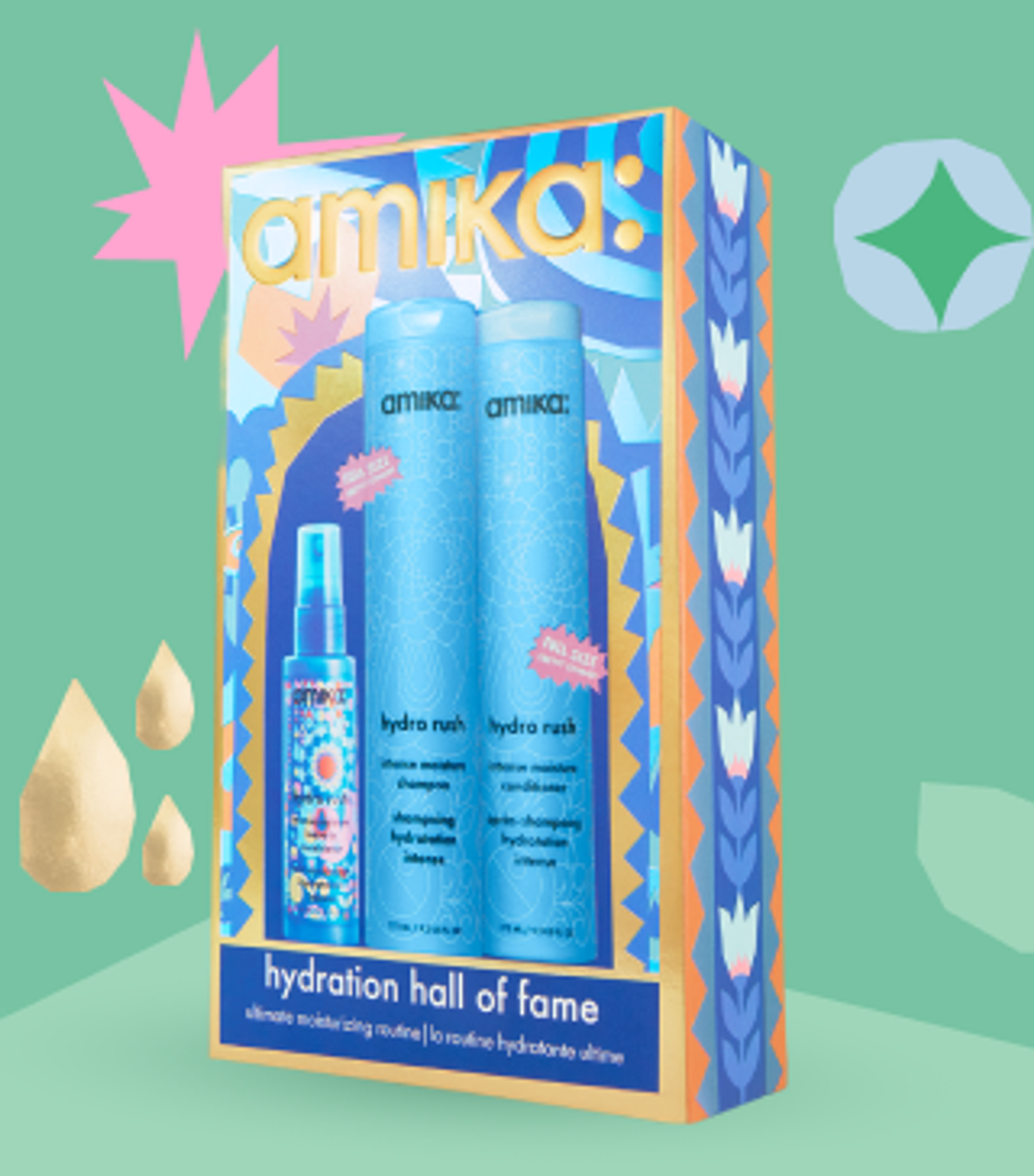 amika hydration hall of fame holiday gift set posed against a light green background and with some gold shapes behind the box