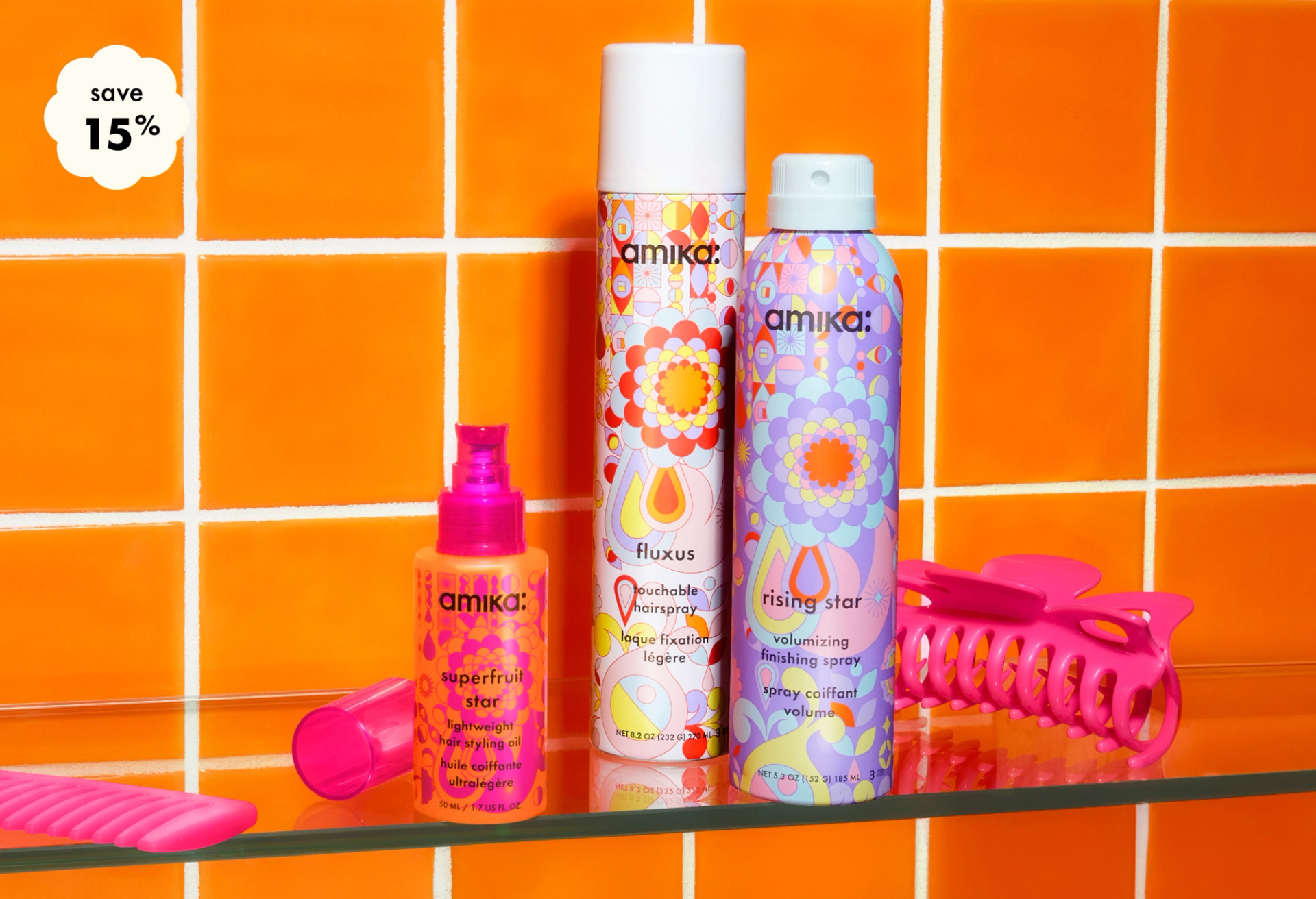 save 15% on your custom amika styling bundle - 3 bottles of amika products and a pink clip sit on a shelf in frount of an orange tiled background