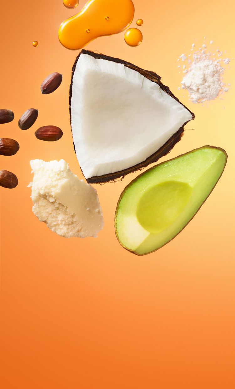 ingredient images of avocado, coconut, shea butter on an orange background