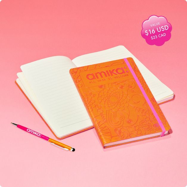 pen and notebook gwp on pink background