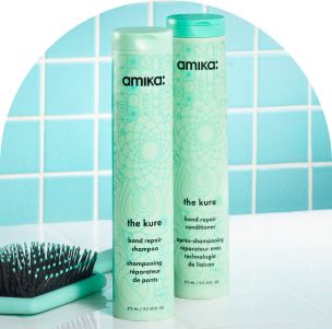 Image of the kure shampoo and conditioner against a green tiled background.