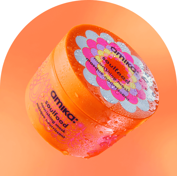 amika soulfood mask floating against an orange background