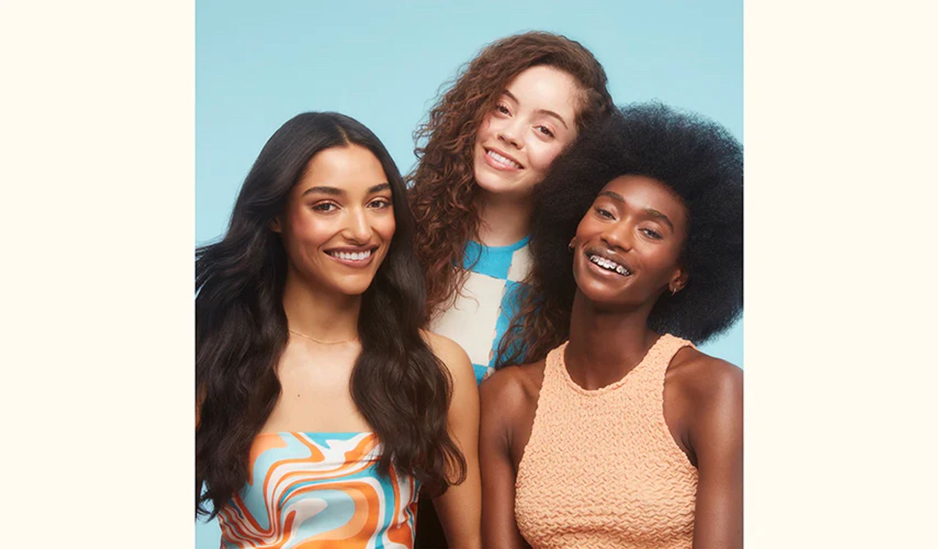 three models posing together