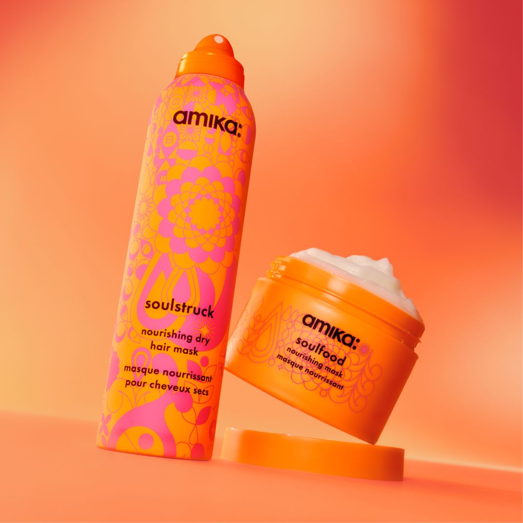 amika soulstruck spray and soulstruck mask sit against a pinkish-orange background